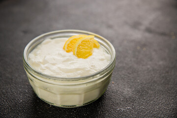 Lemon yogurt natural product skyr sour milk skir fresh delicious gourmet food background on the table rustic food top view copy space keto and paleo diet vegetarian food
