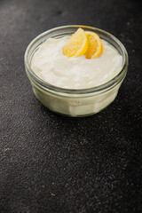 Lemon yogurt natural product skyr sour milk skir fresh delicious gourmet food background on the table rustic food top view copy space keto and paleo diet vegetarian food