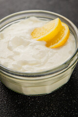 Lemon yogurt natural product skyr sour milk skir fresh delicious gourmet food background on the table rustic food top view copy space keto and paleo diet vegetarian food