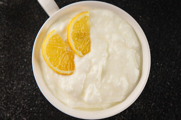 Lemon yogurt natural product skyr sour milk skir fresh delicious gourmet food background on the...