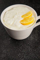Lemon yogurt natural product skyr sour milk skir fresh delicious gourmet food background on the table rustic food top view copy space keto and paleo diet vegetarian food