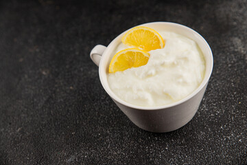 Lemon yogurt natural product skyr sour milk skir fresh delicious gourmet food background on the table rustic food top view copy space keto and paleo diet vegetarian food