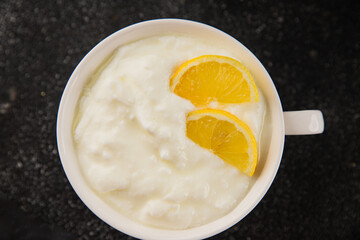 Lemon yogurt natural product skyr sour milk skir fresh delicious gourmet food background on the table rustic food top view copy space keto and paleo diet vegetarian food