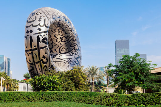 Dubai, UAE - December 9, 2024: Panoramic view of modern futuristic Museum of Future. Arabic script on walls close-up. Building is built according designed by architect Shaun Killa.