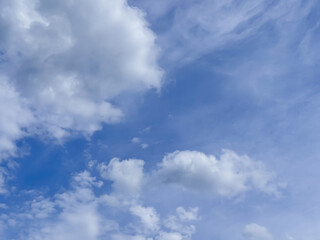 Fototapeta premium Blue Sky with White Fluffy Clouds on Clear Summer Day