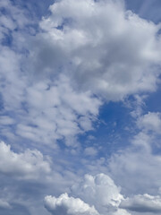 Obraz premium Blue Sky with White Fluffy Clouds on Clear Summer Day
