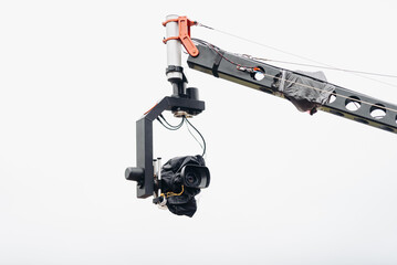 black movie camera on large crane