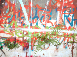 Street art. Abstract creative drawings of fashionable colors on the walls of the city. Urban contemporary culture. Abstract stylish drawing, label on the wall, fragment of graffiti