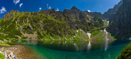 Panorama of Czarny Staw pod Rysami, a mountain lake in the Tatra Mountains in Zakopane, Poland © momo11353