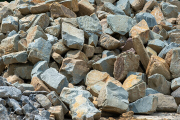 Stone Background with Mixed Sizes, Natural background featuring stones of various sizes and shapes, creating an organic and raw texture. gravel texture stones background