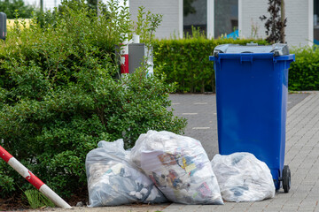  waste separation,Many blue garbage bags lie on the floor waiting for the authorities to collect...