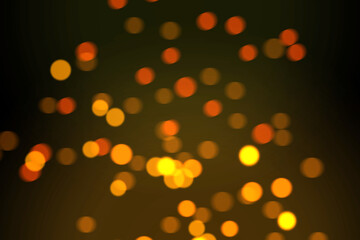 Abstract blurred background of golden bokeh with light effect