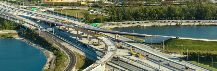 Aerial view of busy american freeway road interchange under construction in Miami, Florida....