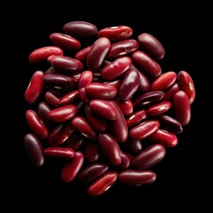 Vibrant red kidney beans clustered together against dramatic black background, showcasing glossy texture and rich burgundy color for food photography in healthy nutrition industry