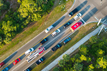 Car accident on highway road in Florida. Emergency services personnel helping victims of vehicle...