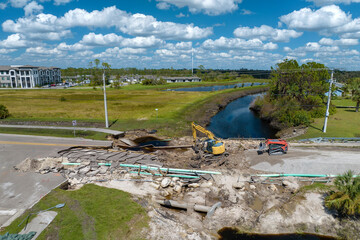 Repair of destroyed bridge after hurricane flood in Florida. Reconstruction of damaged road after...