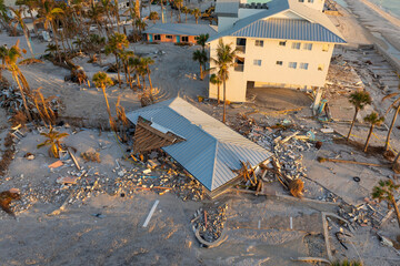 Ruined buildings in need of demolition or repair. Storm surge water and wind damaged houses roof...