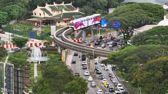 day time kuala lumpur city center traffic street road monorail line aerial panorama 4k malaysia 