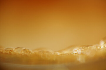 Macro shot of coffee foam in a cup as background