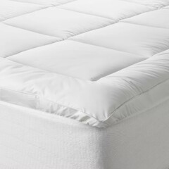 Soft mattress topper placed on a bed for enhanced comfort and support during nighttime sleep.