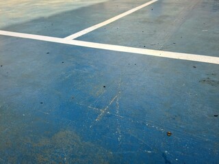 White line on blue tarp surface