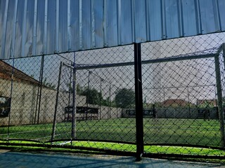 Mini soccer or futsal goalpost viewed from behind the net