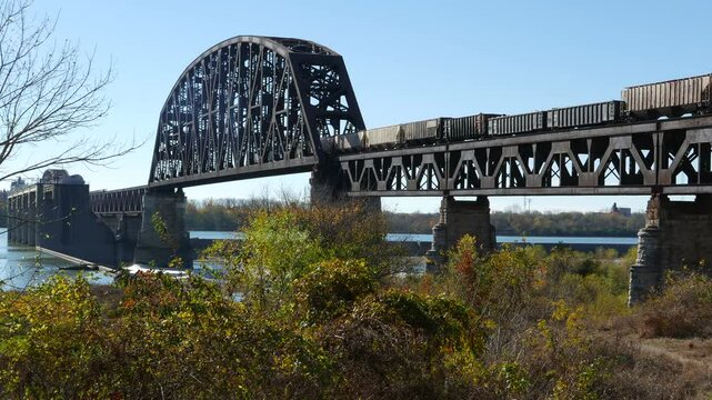 Train railroad crossing the Ohio River on the Clark Memorial bridge connecting Louisville, Kentucky and Jeffersonville, Indiana. .
