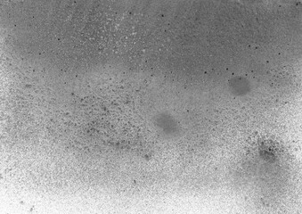Grey grunge paint spray texture. Dusty abstract background. Rough particle overlay template.