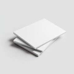 Three blank, rectangular booklets stacked slightly askew on a light gray background, showcasing clean, minimalist design