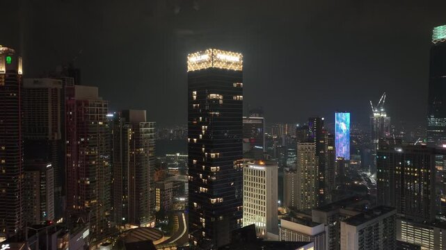 night time illuminated kuala lumpur city downtown aerial panorama 4k malaysia