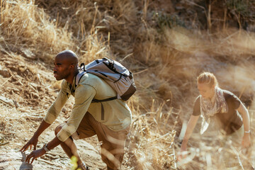 Young and diverse group of friends and hikers hiking together in the mountains of south africa