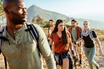 Young and diverse group of friends and hikers hiking together in the mountains of south africa