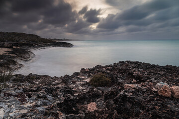 Sunset on the sandy beach of the Atlantic Ocean.