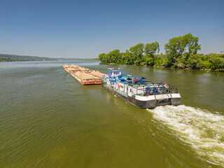 Drone view of a barge navigating the Sava River in Smederevo Serbia on a clear summer day