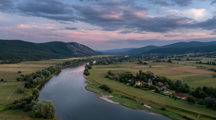 Obraz premium stunning aerial view serene beauty of rural landscapes in eastern europe showcasing lush green fields meandering