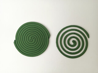 Green mosquito repellent coils create protection from mosquito bites, perfect for indoor or outdoor...