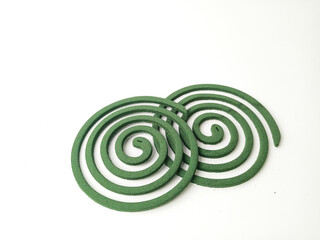 Two green mosquito coils offer protection from insect bites and create a peaceful outdoor...