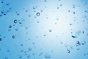 Hyaluronic acid gel or serum texture. Abstract blue liquid background with bubbles. Skincare,...