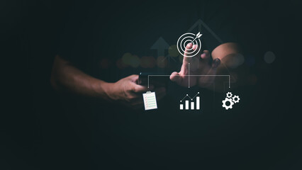 Concept of a flowchart to a goal. The businessman is showing a flowchart of operations to achieve a goal or objective, strategic planning, online marketing.
