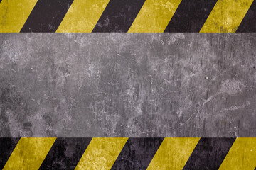 Safety sign on a yellow and black stripe