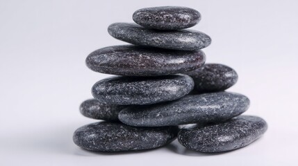 Stack of Dark Grey Textured Stones on White Background