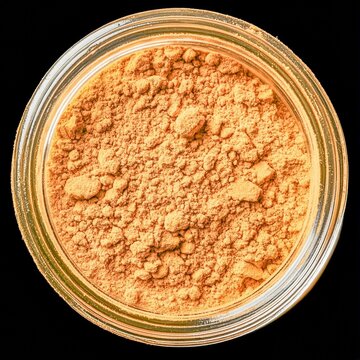 closeup of maca root powder in a glass jar with goldenbrown texture macro Andean superfood photography background