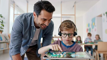 A teacher guides a young student using a tablet in a classroom setting. - Powered by Adobe
