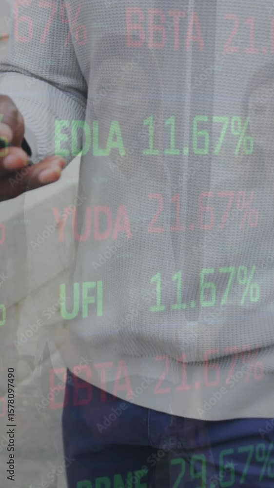 Poster animation of stock market data processing over mid section of man using smartphone on the street