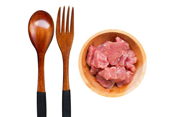 minced beef in a wooden bowl with a fork and spoon beside it