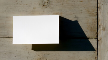 A blank notecard on light wood, embodying simplicity and natural beauty.