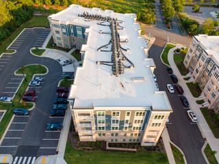 Sunset Drone Images of Large TPO Roofs on Commercial Buildings and Apartments: Architecture, Industry, Engineering
