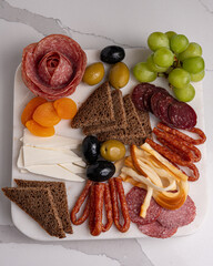 Assorted charcuterie with cheese olives bread and sausages