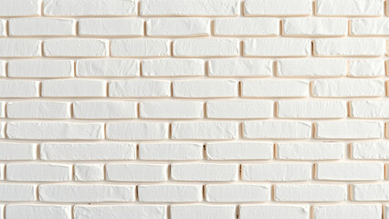 Fototapeta premium Close up of a white painted brick wall with visible mortar joints and textured brick surfaces shown