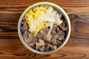 top view portable clay pot rice with beef at horizontal composition